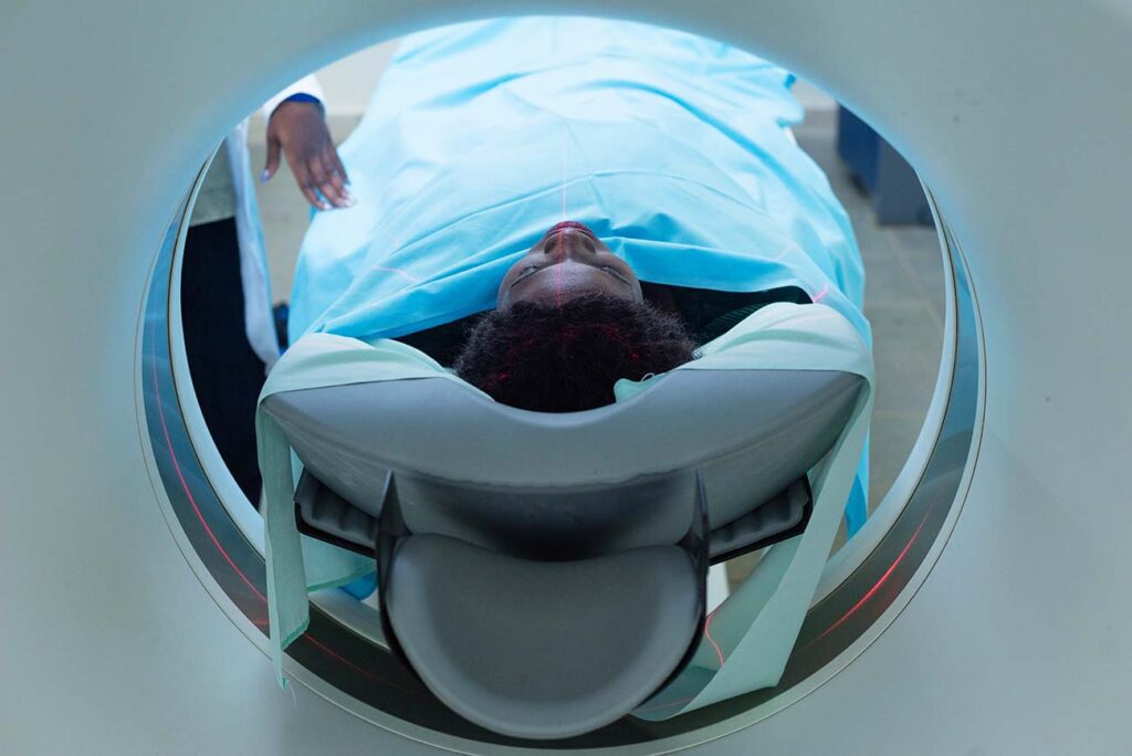 A-female-patient-lays-inside-a-CT-scan-in-a-hospital-in-kampalaUganda