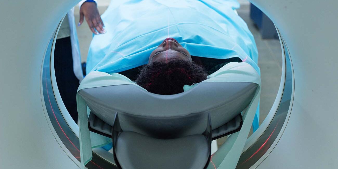 A-female-patient-lays-inside-a-CT-scan-in-a-hospital-in-kampalaUganda